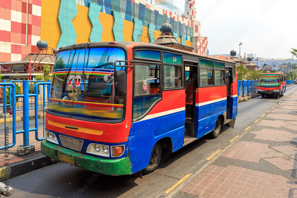 Metro Mini bus on the streets of Jakarta, Indonesia, a common way of public transportation, on July 31, 2015