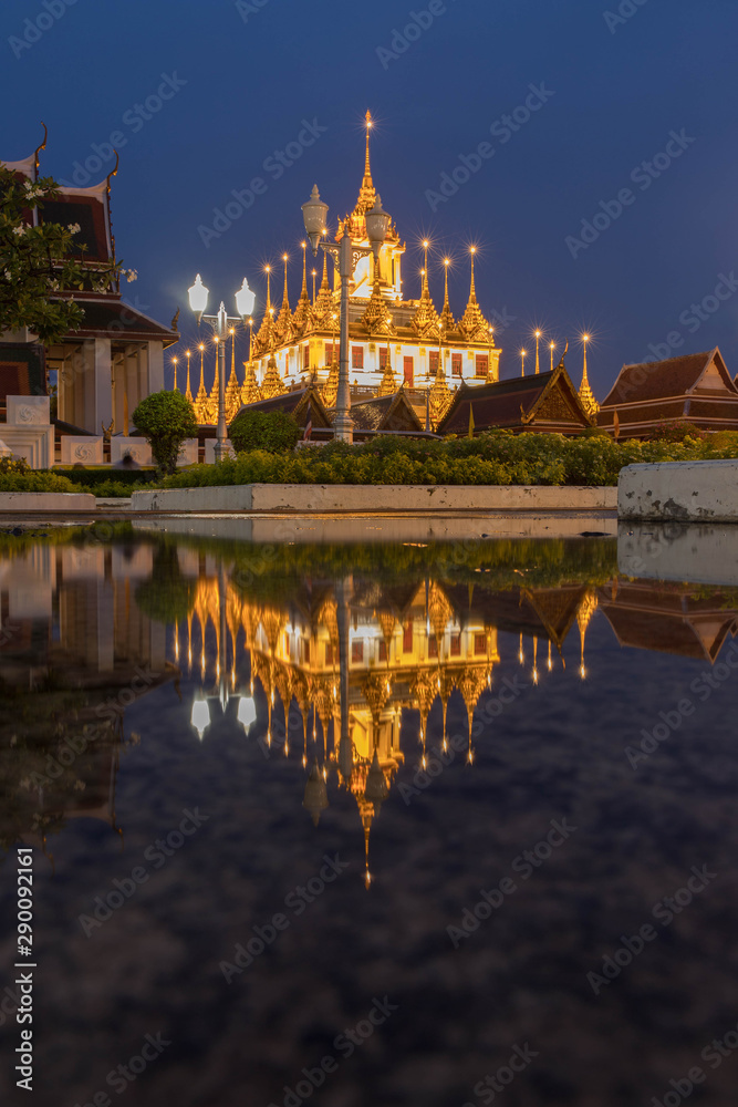 Reflection of Wat Ratchanatdaram Temple the beautiful golden castle or pagoda Bangkok, Thailand