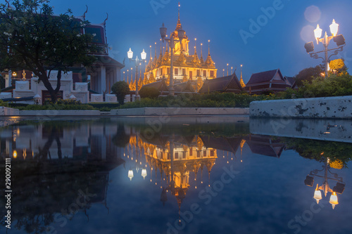 Blurry soft and flair Wat Ratchanatdaram Temple the beautiful golden castle or pagoda Bangkok, Thailand