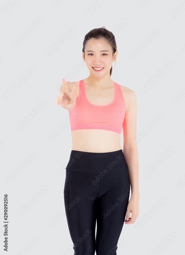 Beautiful portrait young asian woman in sport clothes with satisfied and confident gesture finger v sign isolated on white background, asia girl have shape and wellness, exercise for fit with health. Beautiful portrait young asian woman in sport clothes with satisfied and confident gesture finger v sign isolated on white background, asia girl have shape and wellness, exercise for fit with health.