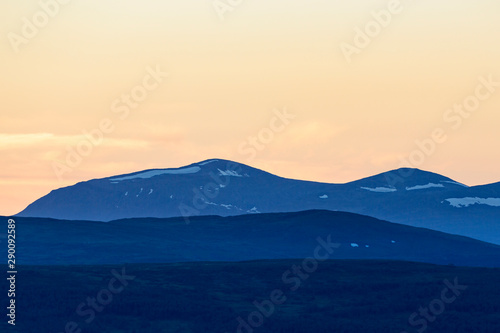 Twilight in the wilderness with forest and mountains