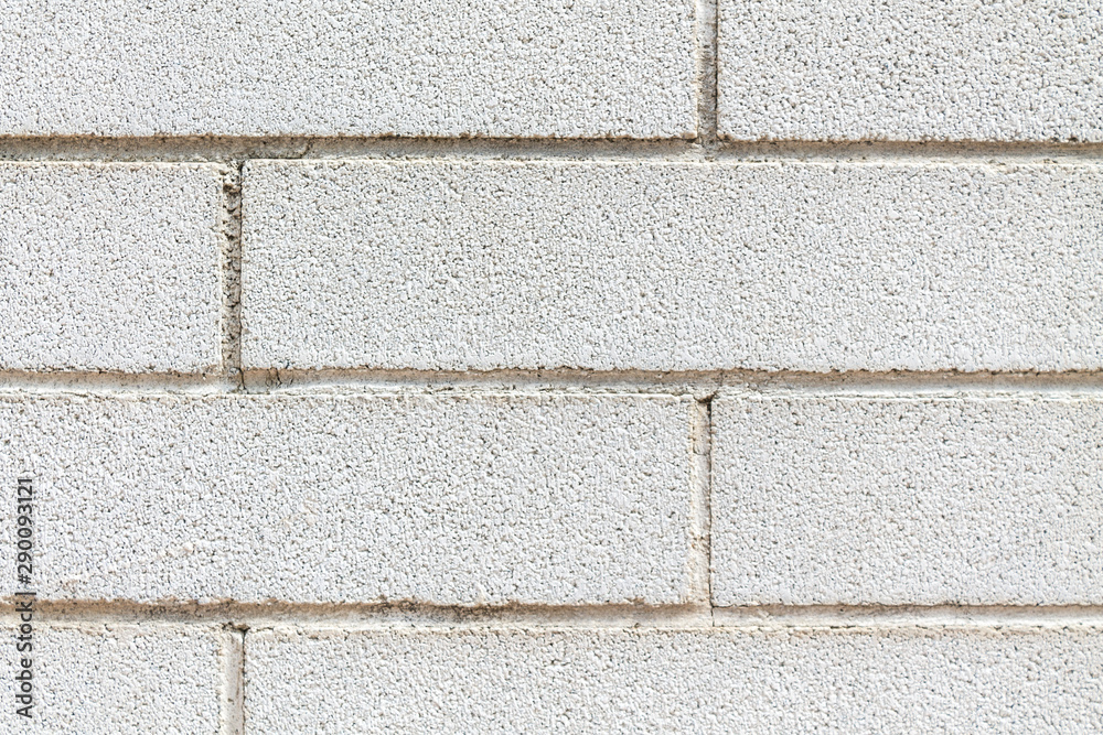 Fototapeta premium A white wall full of bricks