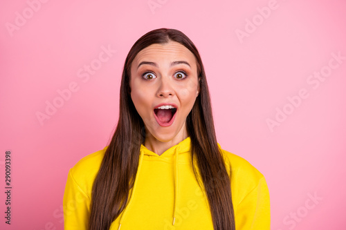 Photo of overjoyed rejoicing cute nice pretty sweet girlfriend amazed with something wearing bright yellow sweater while isolated over pastel color background