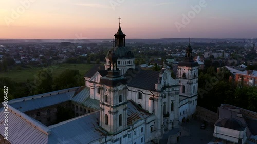 Medieval Catholic ancient castle-fortress in Berdichiv city, Ukraine. Monastery of the Barefoot Carmelites. Aerial survey, flight of drone photo