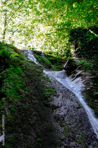 Waterfall from ravine.waterfall from the mountain river. rapid current
