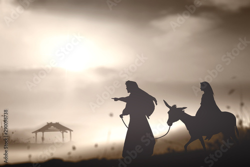 Christmas religious nativity concept: Silhouette pregnant Mary and Joseph with a donkey on star of cross background	 photo