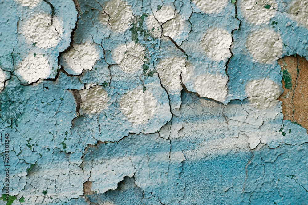 Wall painted with green, white and blue paint, texture, closeup Wall painted with green, white and blue paint, texture, closeup