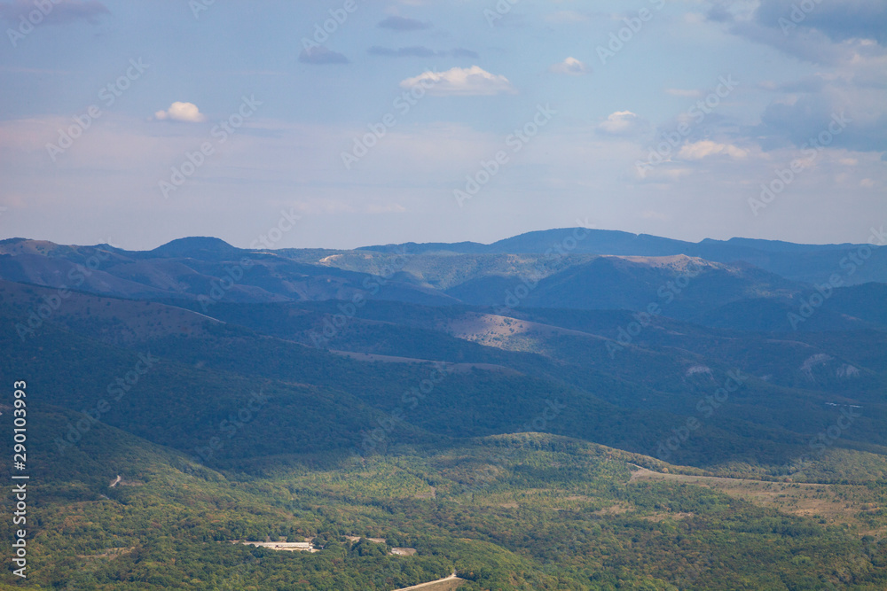 Obraz premium Beautiful view of the mountain peaks on a summer day.