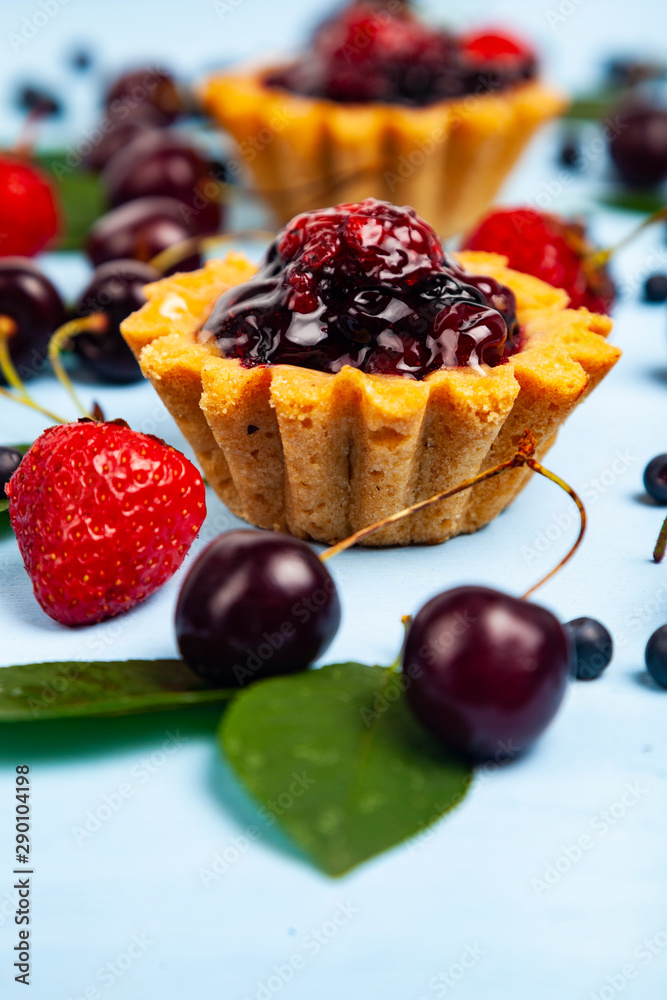 Small berry cake and ripe berries