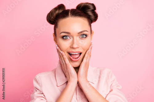 Close up photo of astonished funny youth touching her cheeks shouting wearing pastel color jacket isolated over pink background