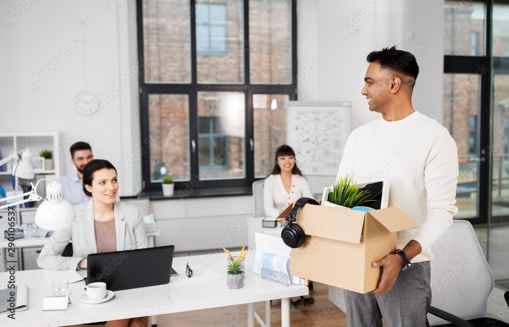 business, new job and quit concept - happy smiling indian male office worker with personal stuff business, new job and quit concept - happy smiling indian male office worker with personal stuff