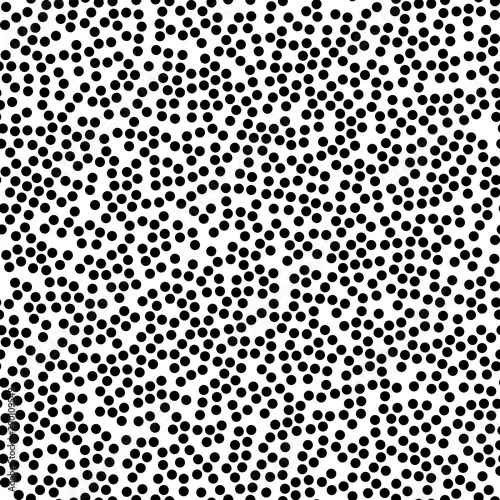 Random scattered polka dots, abstract black and white background.