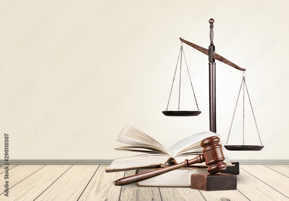 Wooden judge hammer on book with copyspace. Justice and law concept Wooden judge hammer on book with copyspace. Justice and law concept