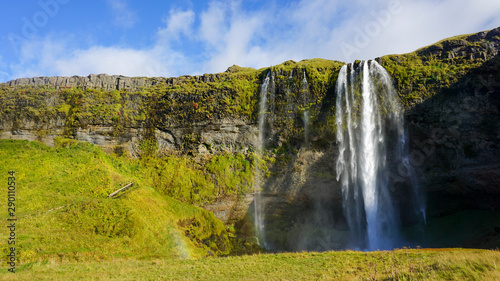 Beautiful Seljalandsfoss one of famous waterfall in Iceland and sunny day and blue sky in summer.