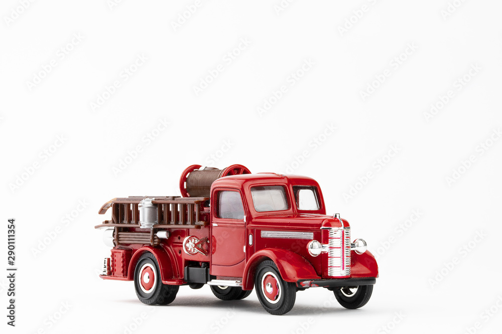 vintage red fire truck toy on white background