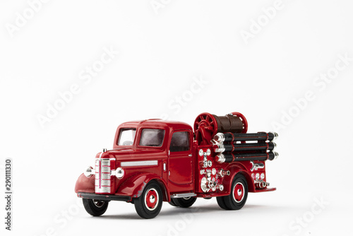 vintage red fire truck toy on white background
