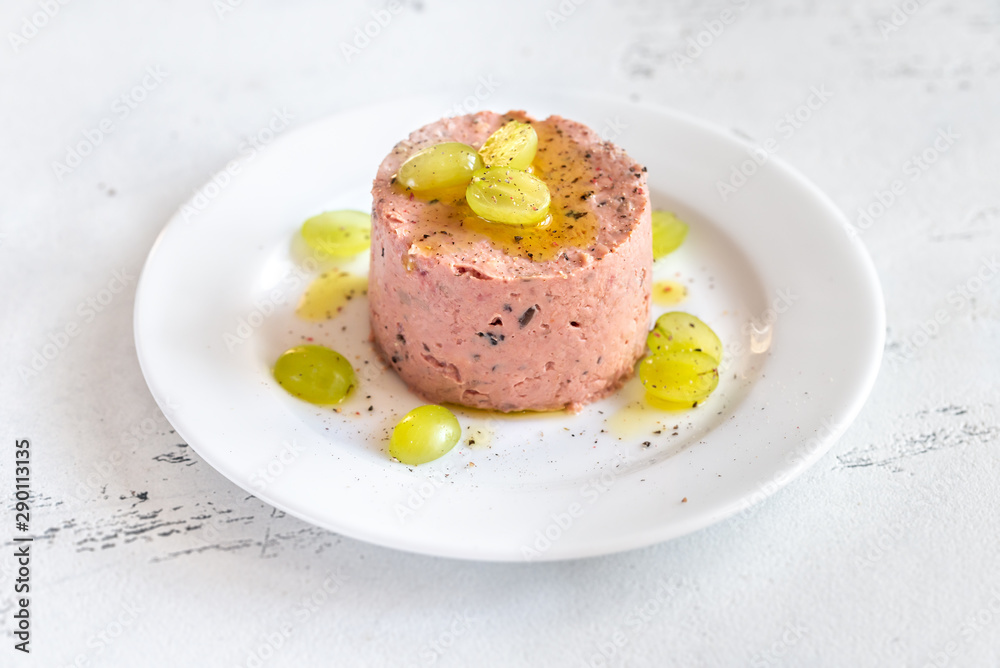 Portion of pate with fresh grapes