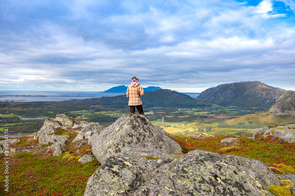 Woman on the mountain Gurumanen in Northern Norway