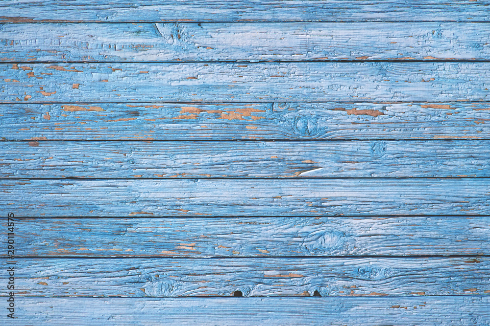 Old wooden fence painted in blue. Old wooden fence painted in blue.