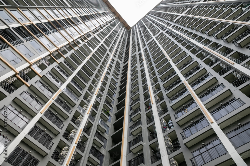 Nonthaburi ,Thailand. -AUGUST 07, 2019 Modern condo building in Nonthaburi - wide angle view from below of a concrete city tower. Nonthaburi ,Thailand. -AUGUST 07, 2019 Modern condo building in Nonthaburi - wide angle view from below of a concrete city tower.
