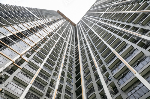 Nonthaburi  Thailand. -AUGUST 07  2019  Modern condo building in Nonthaburi - wide angle view from below of a concrete  city tower.
