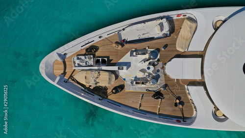 Aerial drone top down photo of luxury yacht docked in tropical exotic destination port with turquoise opean ocean sea © aerial-drone