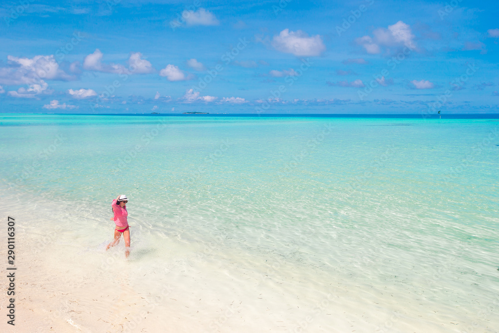 Beautiful woman relaxing at white sand tropical beach