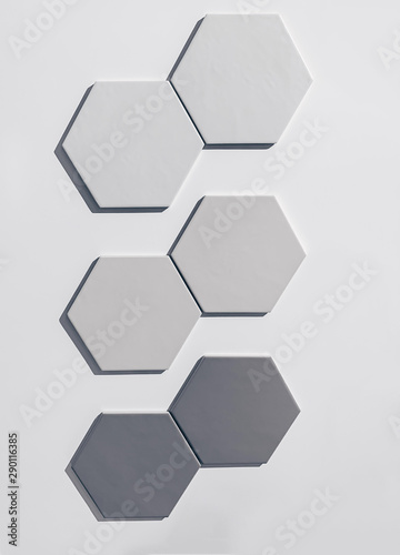real photo: set of white gray and black hexagonal tiles wall on white background