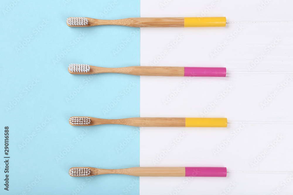 Bamboo toothbrushes on colorful background