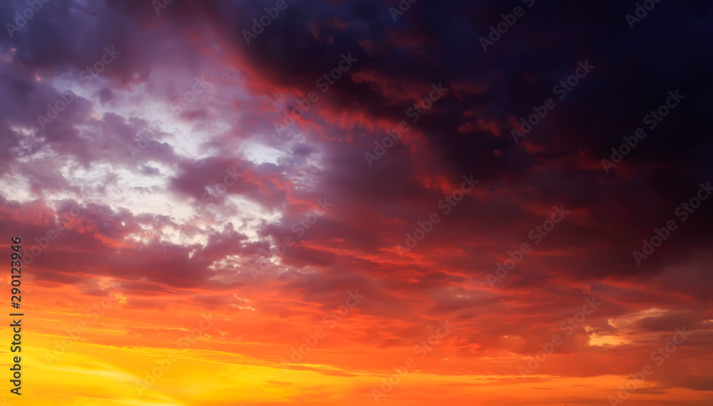natural texture of sunset bright sky with different shades of pink and lilac iridescence on Golden clouds