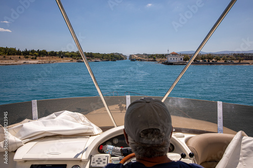 Waiting for passing by yacht outside of the Corinth Canal, Greece. The Corinth Canal connects the Gulf of Corinth with the Saronic Gulf in the Aegean Sea.