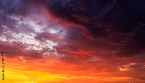 natural texture of sunset bright sky with different shades of pink and lilac iridescence on Golden clouds