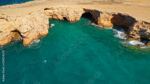 Aerial drone photo of iconic caves of Xylobatis or Ksylompatis in Koufonisi island, Small Cyclades, Greece photo