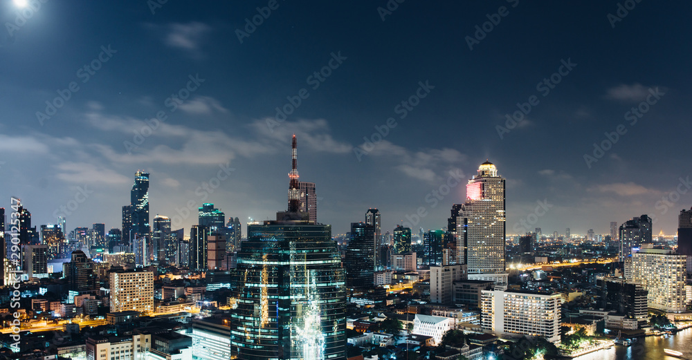 City at night with urban buildings. Aerial view.