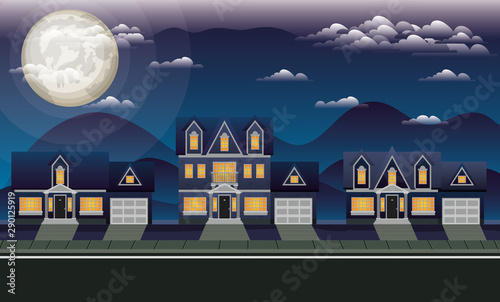 neighborhood street with houses at night scene