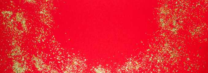 Abstract glitter red gold background festive Christmas decor for greetings with copy space flat lay top view