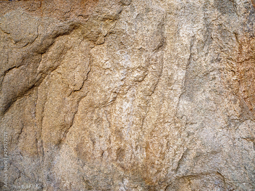 Naklejka premium The rough structure of natural stone. Embossed stone background