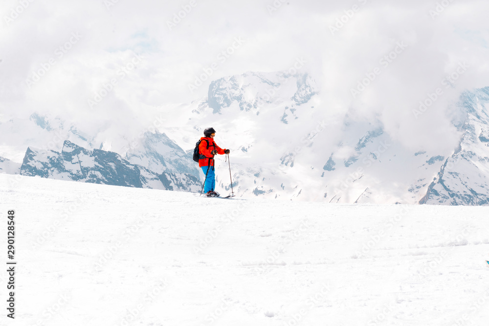 child skiing on a snowy mountain slope, Caucasus,