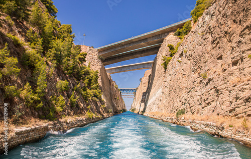 Passing through the Corinth Canal by yacht  Greece. The Corinth Canal connects the Gulf of Corinth with the Saronic Gulf in the Aegean Sea.