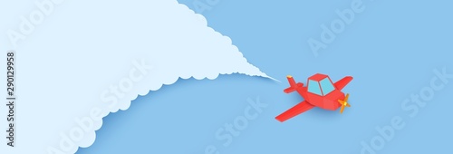 Red airplain flies in blue sky through the clouds in paper cut style. Landscape with 3d origami contrails behind plaine. Vector origami polygonal illustration.