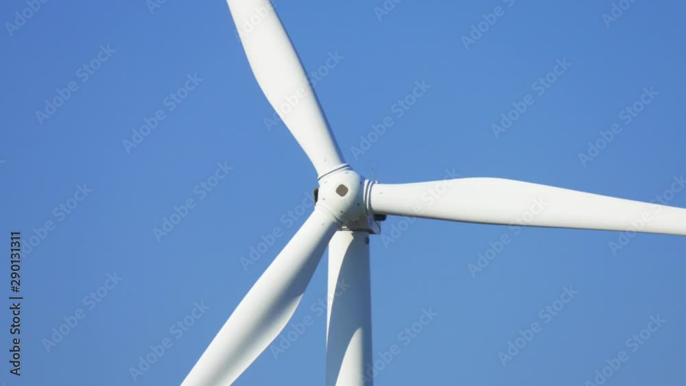 Propellers of windmills on blue sky background, close-up Propellers of windmills on blue sky background, close-up