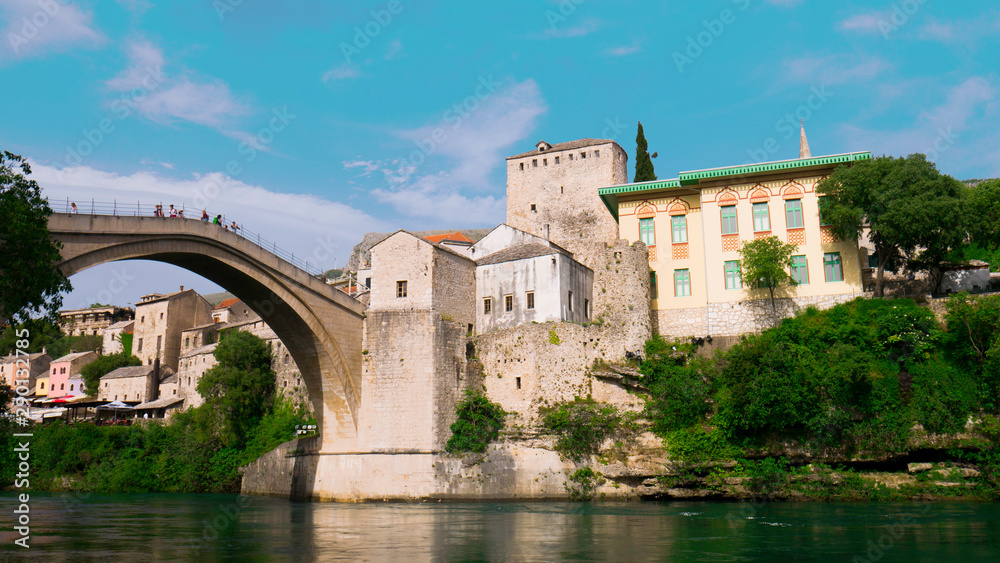 Old town of Mostar and Stari Most bridge above beautiful emerald river Neretva. - April 2019, Mostar, Bosnia and Herzegovina.