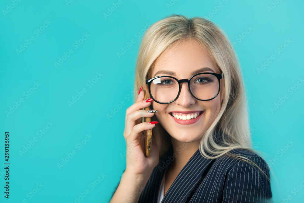 beautiful young woman in a black suit with glasses calls on the phone beautiful young woman in a black suit with glasses calls on the phone