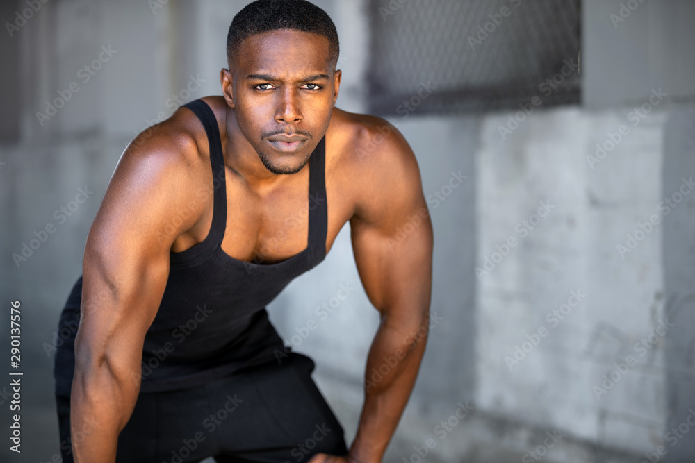 Portrait of african american athlete, urban fitness exercise and training, staring at camera with intense eyes Portrait of african american athlete, urban fitness exercise and training, staring at camera with intense eyes