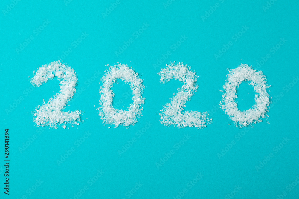 2020 laid out of snow on turquoise background, copy space 2020 laid out of snow on turquoise background, copy space