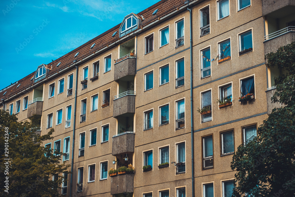 Fototapeta premium brown gdr building with small balcony