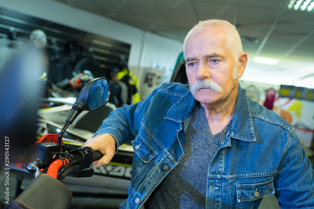 senior man hand steering motorcycle senior man hand steering motorcycle
