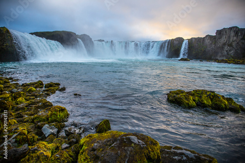 Bottom of Godafoss waterfall with sunset in the background, Iceland