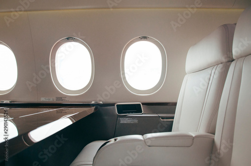 modern and comfortable interior of business jet aircraft with decor