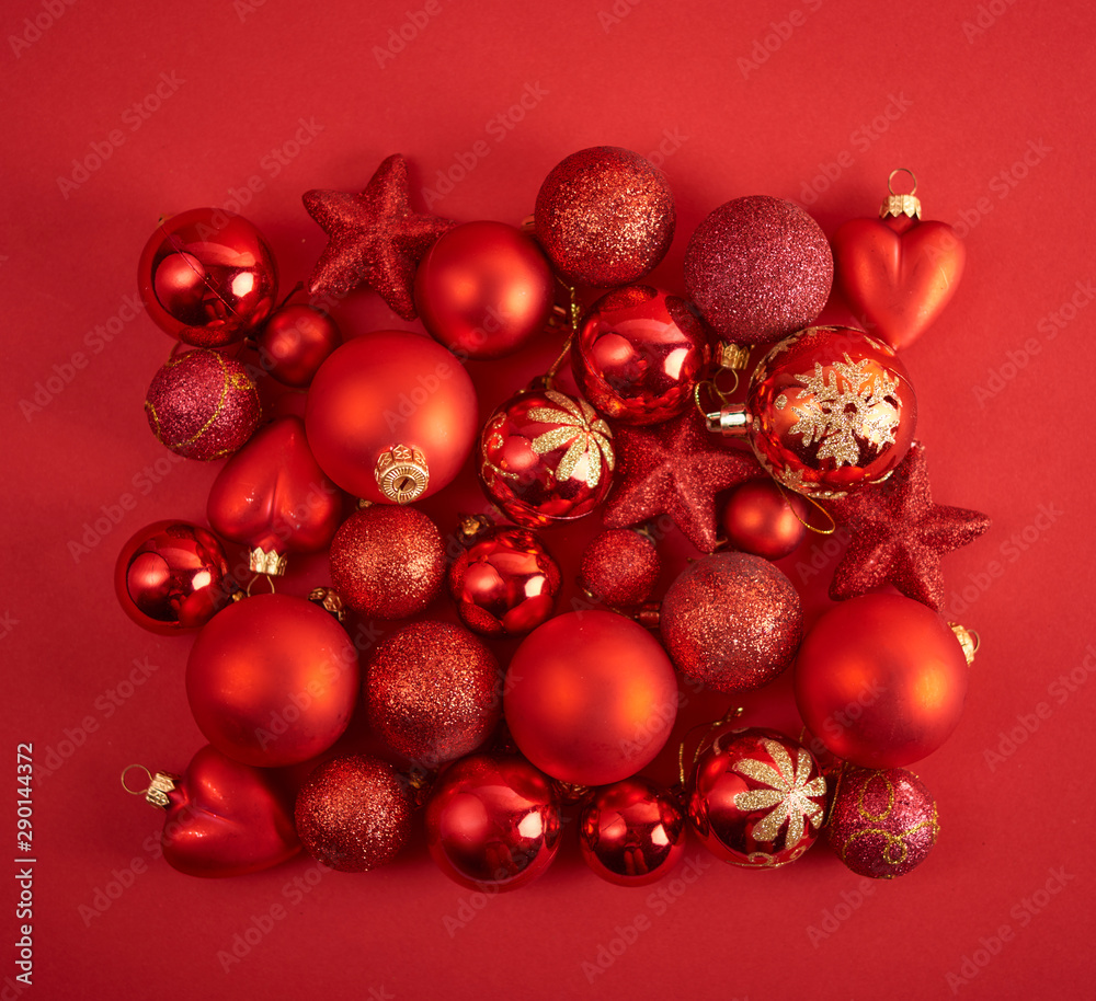 Christmas background. Set with a lot of different baubles over red background. Christmas background. Set with a lot of different baubles over red background.